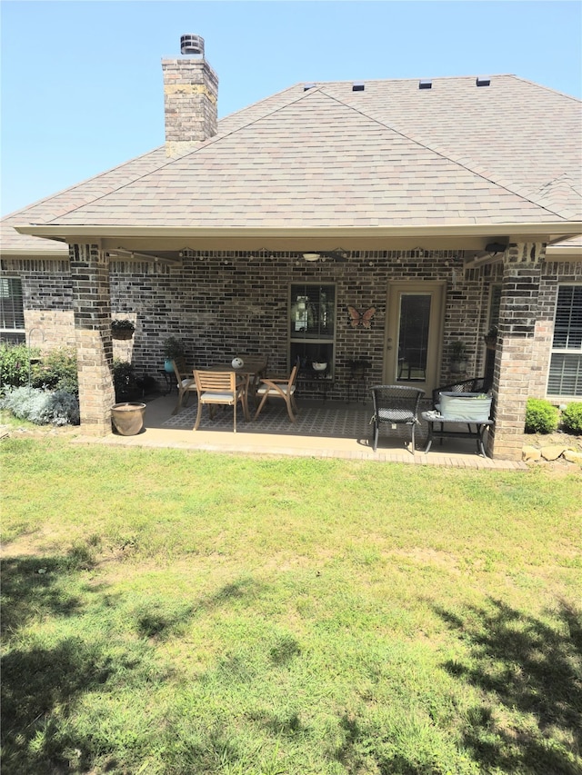 16 Cedar Bayou Cir, Pottsboro, TX 75076 - rear view of property with a yard, a chimney, a patio, and brick siding