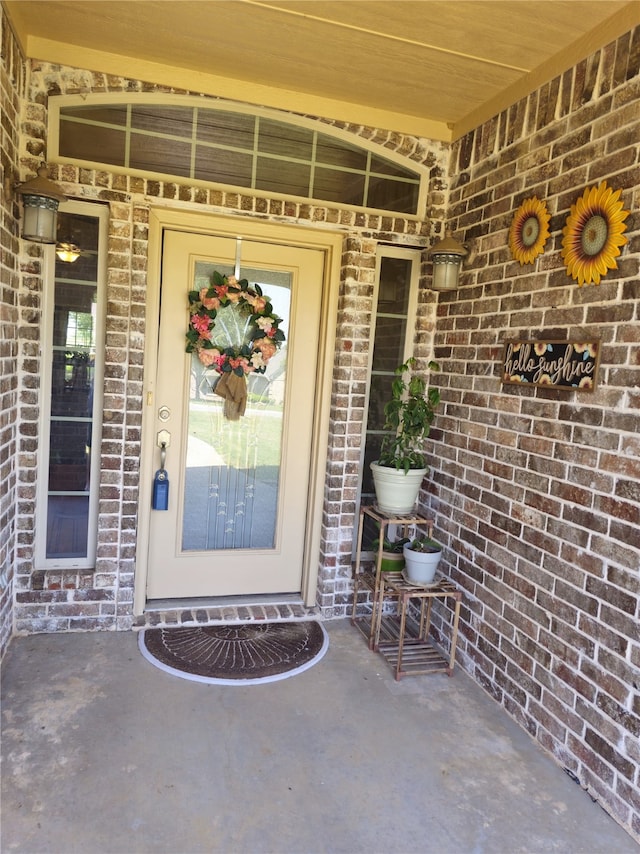 16 Cedar Bayou Cir, Pottsboro, TX 75076 - doorway to property featuring brick siding