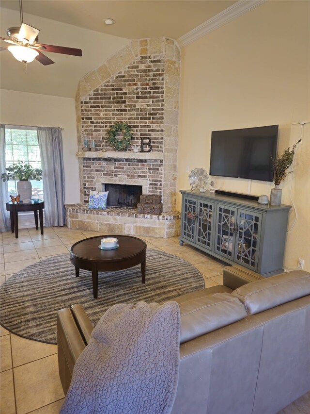 16 Cedar Bayou Cir, Pottsboro, TX 75076 - tiled living area featuring a fireplace, ceiling fan, vaulted ceiling, and ornamental molding