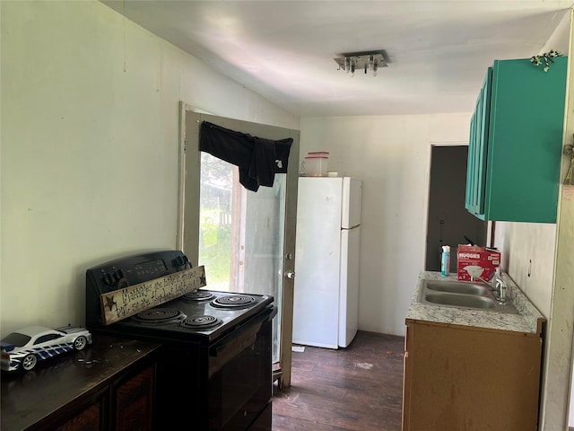 3052 Vz County Road 3810, Wills Point, TX 75169 - kitchen featuring electric range, freestanding refrigerator, a sink, dark wood-style floors, and light countertops