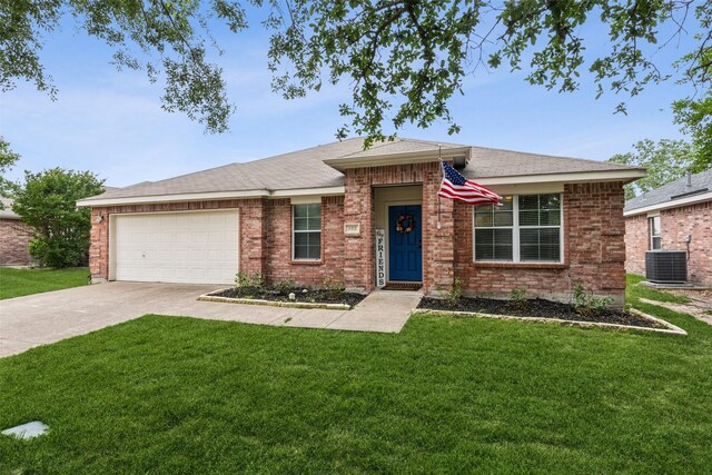 202 Freedom Trl, Forney, TX 75126 - ranch-style house featuring concrete driveway, a garage, and a front lawn