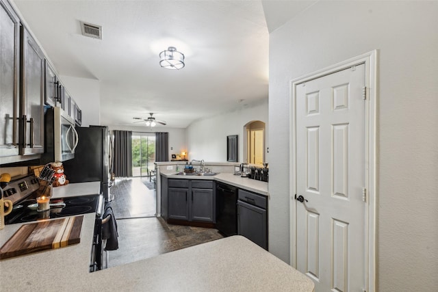 202 Freedom Trl, Forney, TX 75126 - kitchen with stainless steel appliances, a peninsula, arched walkways, ceiling fan, and a sink