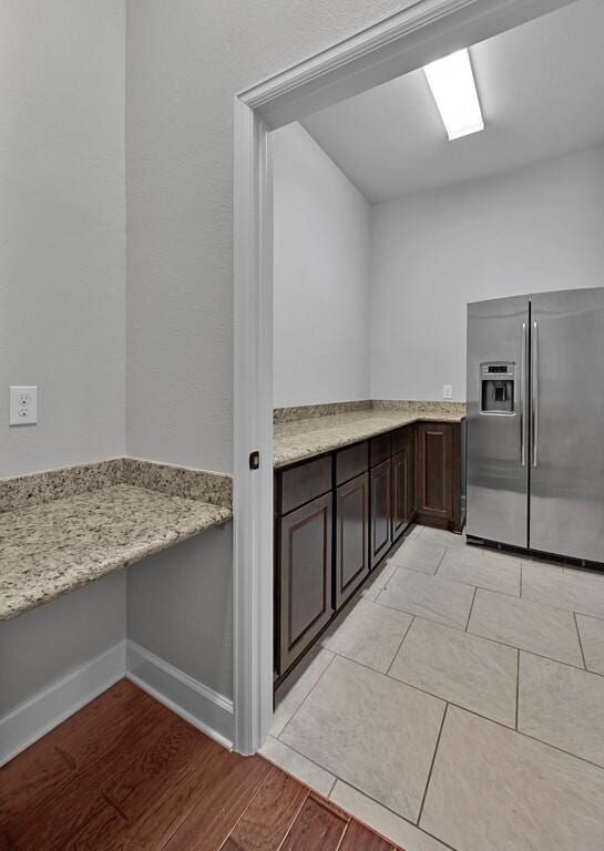 17015 Salado Dr, Woodway, TX 76712 - laundry area featuring light wood finished floors and baseboards