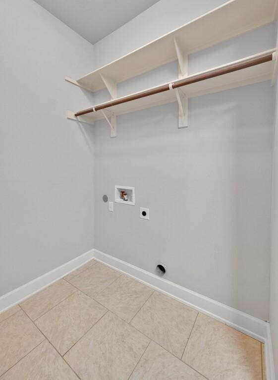 17015 Salado Dr, Woodway, TX 76712 - laundry area featuring hookup for an electric dryer, washer hookup, baseboards, and light tile patterned floors