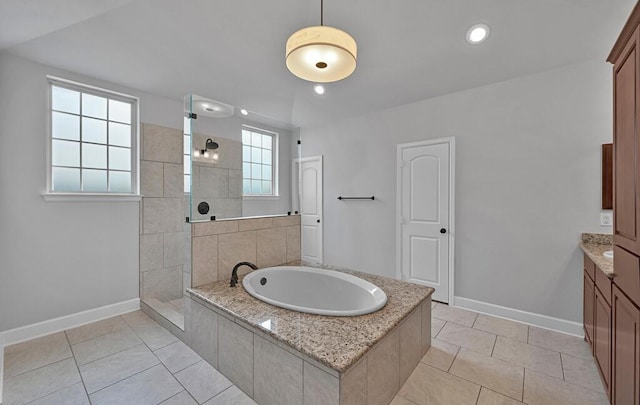 17015 Salado Dr, Woodway, TX 76712 - bathroom featuring walk in shower, baseboards, a garden tub, tile patterned flooring, and vanity