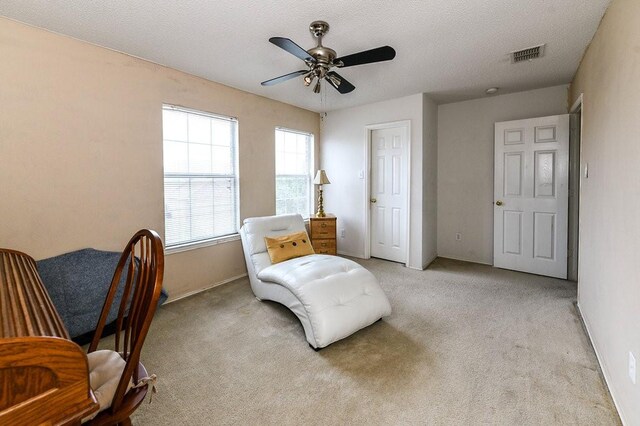 918 Telluride Dr, Arlington, TX 76001 - sitting room with light carpet, a ceiling fan, and baseboards