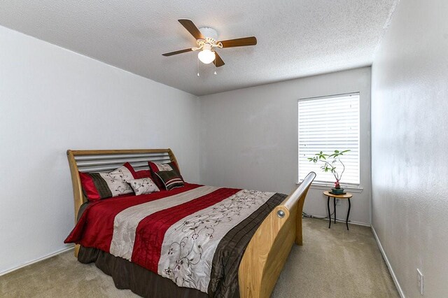 918 Telluride Dr, Arlington, TX 76001 - bedroom featuring light colored carpet, a textured ceiling, baseboards, and ceiling fan