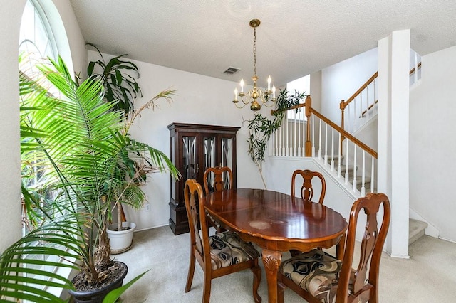 918 Telluride Dr, Arlington, TX 76001 - dining area with light colored carpet, a chandelier, and stairs