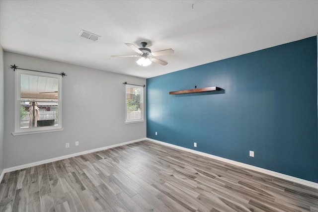 1612 Marble Cove Ln, Denton, TX 76210 - spare room with wood finished floors, ceiling fan, and baseboards