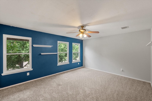 1612 Marble Cove Ln, Denton, TX 76210 - unfurnished room with a ceiling fan, healthy amount of natural light, carpet, and baseboards