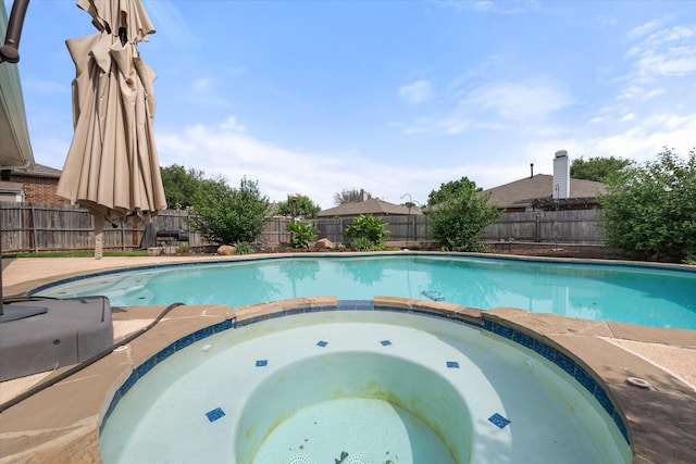 1612 Marble Cove Ln, Denton, TX 76210 - view of swimming pool with a pool with connected hot tub and a fenced backyard