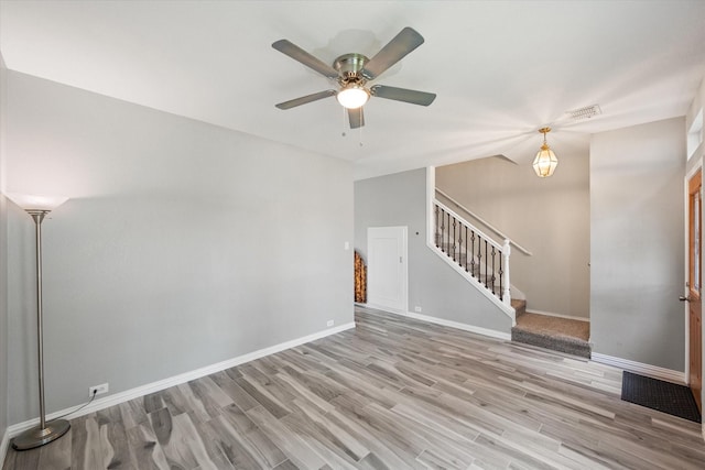 1612 Marble Cove Ln, Denton, TX 76210 - spare room with stairway, wood finished floors, a ceiling fan, and baseboards
