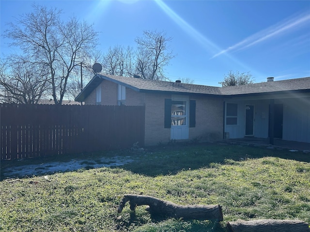 back of house with brick siding and a porch