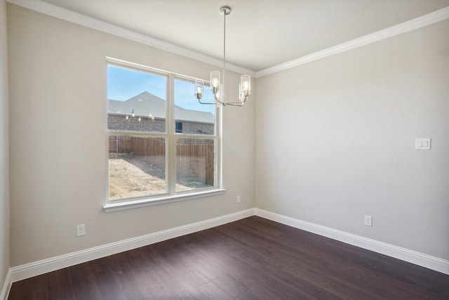 709 Lake Murray Ln, Cleburne, TX 76033 - spare room featuring a chandelier, baseboards, dark wood-style flooring, and ornamental molding