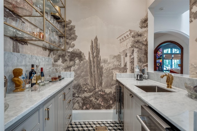 indoor bar featuring arched walkways, wallpapered walls, and dishwasher