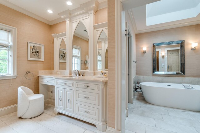 bathroom featuring crown molding, tile patterned flooring, vanity, a soaking tub, and recessed lighting
