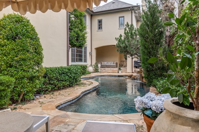 outdoor pool featuring a patio
