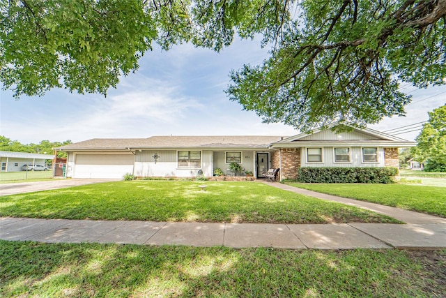 831 Plum St, Graham, TX 76450 - ranch-style home featuring a front lawn, an attached garage, and driveway