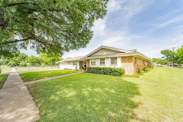 831 Plum St, Graham, TX 76450 - single story home with brick siding, a garage, and driveway