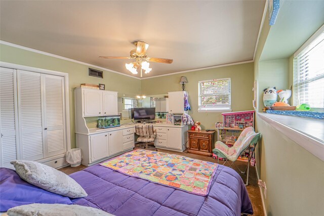 831 Plum St, Graham, TX 76450 - bedroom featuring a closet, a ceiling fan, and ornamental molding