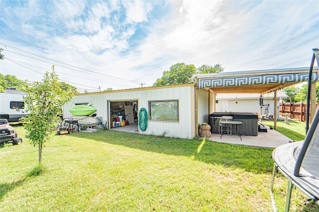 831 Plum St, Graham, TX 76450 - view of yard featuring a hot tub and a patio