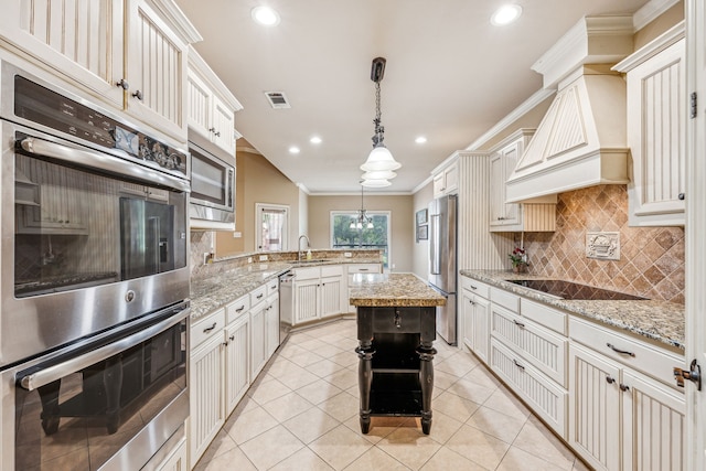 109 Rio Bravo Ct, Weatherford, TX 76088 - kitchen featuring appliances with stainless steel finishes, crown molding, a peninsula, tasteful backsplash, and a sink