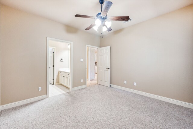 109 Rio Bravo Ct, Weatherford, TX 76088 - unfurnished bedroom with light colored carpet, baseboards, connected bathroom, and ceiling fan
