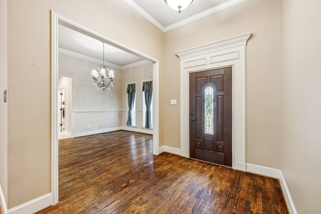 109 Rio Bravo Ct, Weatherford, TX 76088 - entryway with a chandelier, dark wood finished floors, ornamental molding, and baseboards