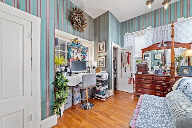 517 W College Ave, Coleman, TX 76834 - office area featuring wallpapered walls and wood finished floors