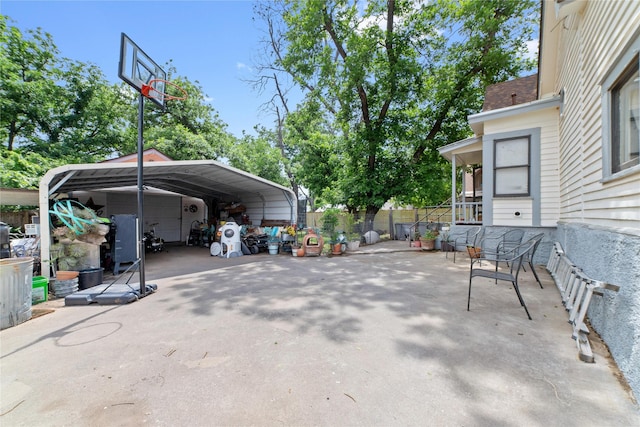517 W College Ave, Coleman, TX 76834 - view of car parking featuring a carport and fence