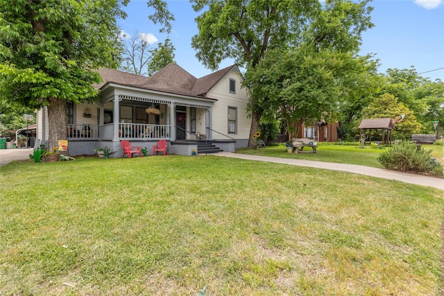 517 W College Ave, Coleman, TX 76834 - victorian-style house featuring a porch, a front lawn, and a shingled roof
