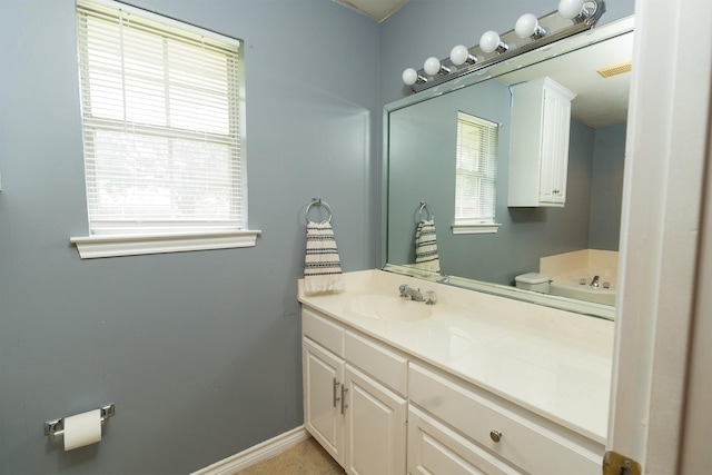 809 Oak Dr, Ennis, TX 75119 - bathroom featuring vanity and baseboards