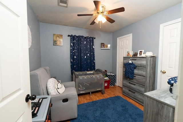 809 Oak Dr, Ennis, TX 75119 - bedroom featuring wood finished floors and ceiling fan