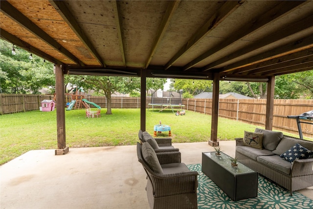 809 Oak Dr, Ennis, TX 75119 - view of patio / terrace with a trampoline, a playground, and an outdoor hangout area