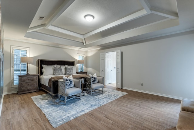 3824 Wyeth Dr, Plano, TX 75023 - bedroom featuring wood finished floors, baseboards, a tray ceiling, and crown molding