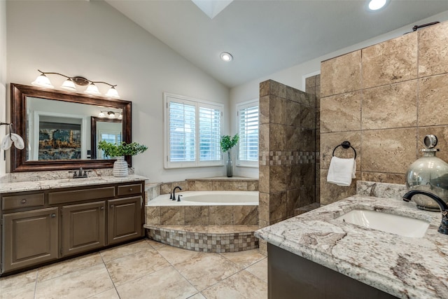 3824 Wyeth Dr, Plano, TX 75023 - full bath featuring two vanities, a bath, recessed lighting, high vaulted ceiling, and a skylight