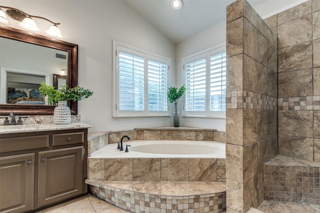 3824 Wyeth Dr, Plano, TX 75023 - bathroom featuring lofted ceiling, a garden tub, vanity, and recessed lighting