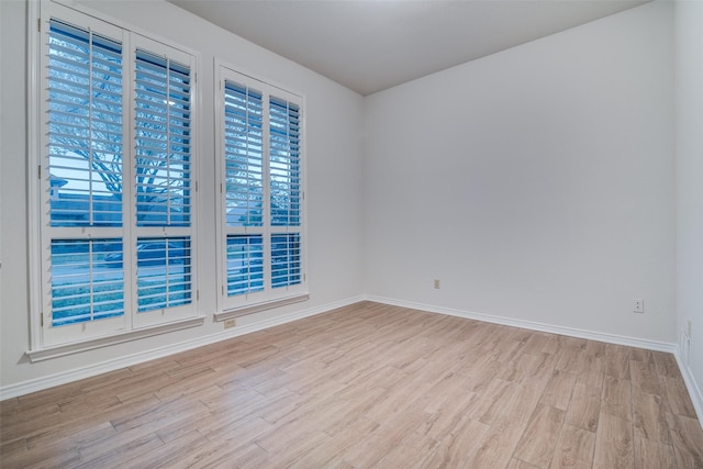 3824 Wyeth Dr, Plano, TX 75023 - spare room featuring wood finished floors and baseboards