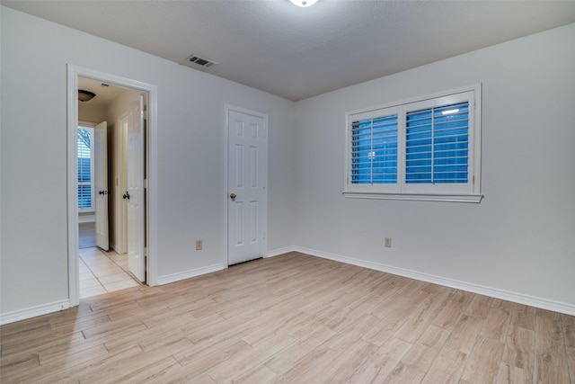 3824 Wyeth Dr, Plano, TX 75023 - spare room featuring light wood finished floors and baseboards