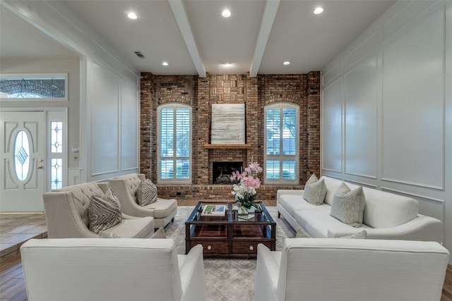 3824 Wyeth Dr, Plano, TX 75023 - living room with a decorative wall, healthy amount of natural light, brick wall, beamed ceiling, and a fireplace