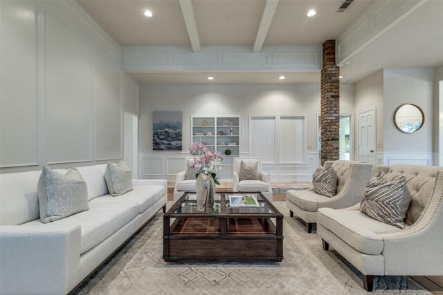 3824 Wyeth Dr, Plano, TX 75023 - living area featuring a decorative wall, beamed ceiling, recessed lighting, decorative columns, and built in shelves