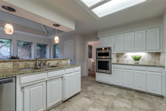 3824 Wyeth Dr, Plano, TX 75023 - kitchen with a sink, stainless steel appliances, decorative backsplash, and white cabinets