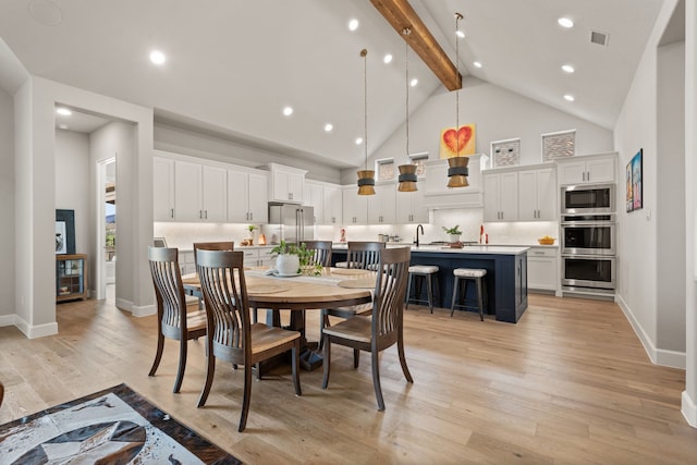 dining room with beam ceiling, light wood-type flooring, high vaulted ceiling, baseboards, and recessed lighting