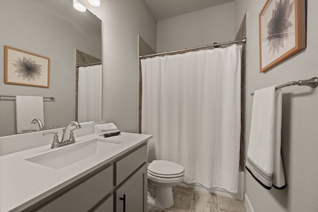 full bathroom featuring toilet, vanity, and curtained shower