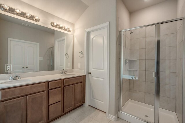 1910 Blackbird Ln, Princeton, TX 75407 - bathroom featuring tile patterned flooring, a stall shower, and double vanity
