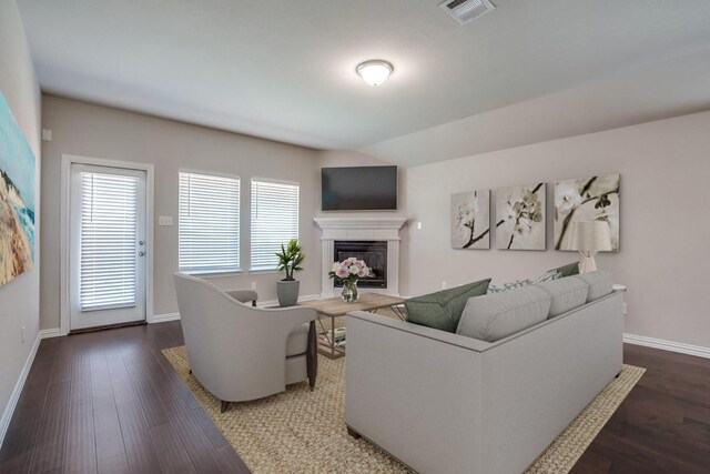 1910 Blackbird Ln, Princeton, TX 75407 - living room with a glass covered fireplace, baseboards, and wood finished floors