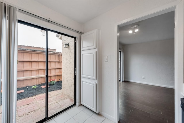 4325 Madera Rd, Irving, TX 75038 - entryway featuring baseboards and light wood-type flooring