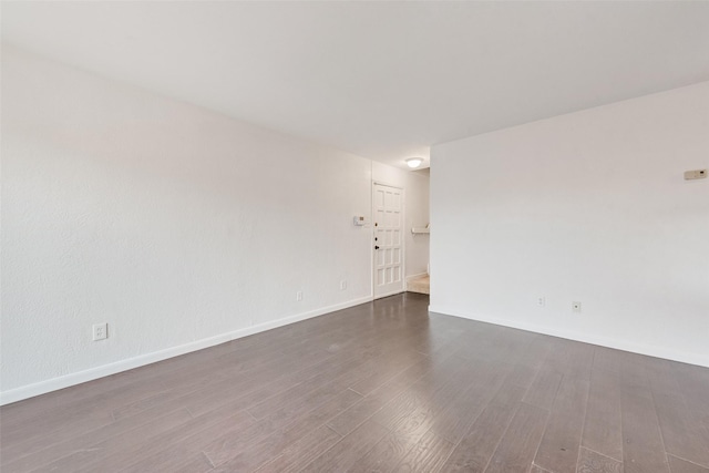 4325 Madera Rd, Irving, TX 75038 - empty room with dark wood-type flooring and baseboards