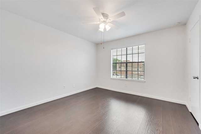4325 Madera Rd, Irving, TX 75038 - spare room featuring dark wood-style floors, baseboards, and ceiling fan