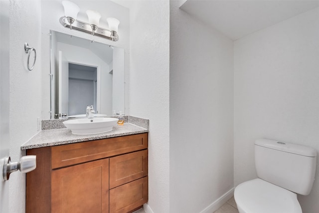 4325 Madera Rd, Irving, TX 75038 - half bath featuring toilet, vanity, baseboards, and tile patterned flooring